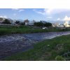 先ほどからの強い夕立により濁流となってしまいました。
